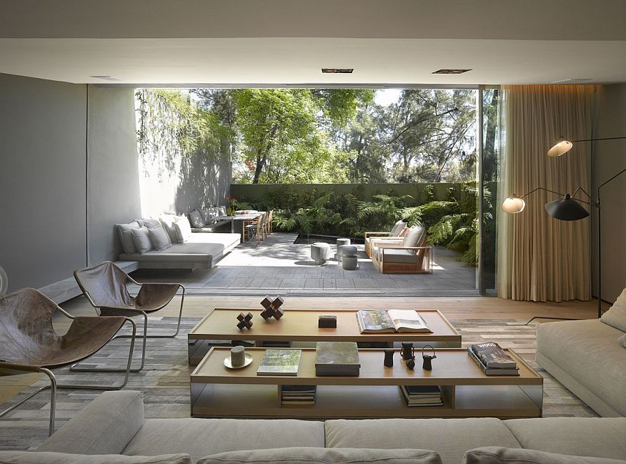 large-glass-wall-overlooking-outdoor-oasis